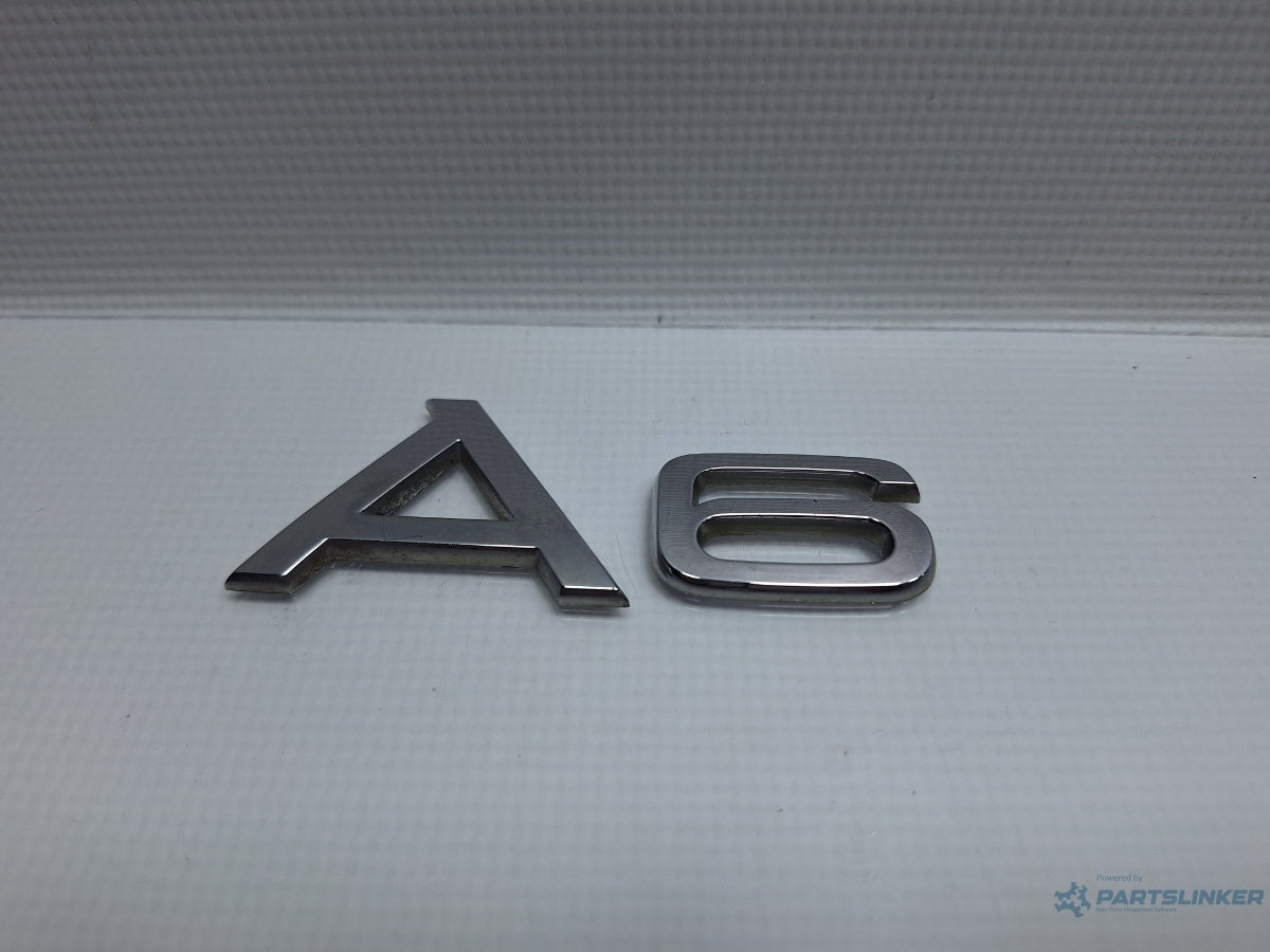 Logo haion AUDI A6 III Allroad (4FH, C6) [ 2006 - 2011 ] TDI quattro (CANC) 140KW|190HP 8H0853737